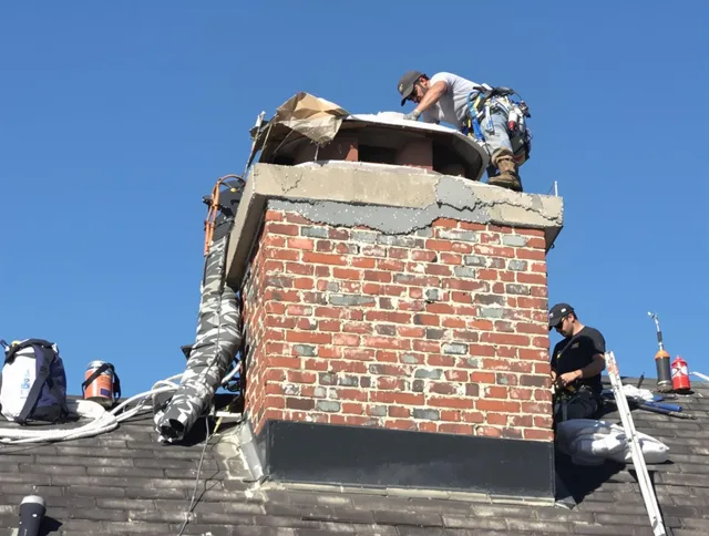 Jupiter Chimney Sweep installing a custom chimney crown in Jupiter, FL