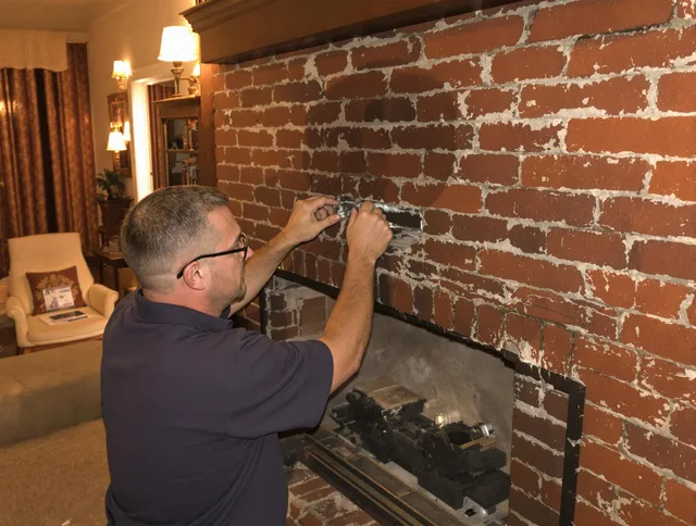 Jupiter Chimney Sweep expert fixing a fireplace in Jupiter, FL